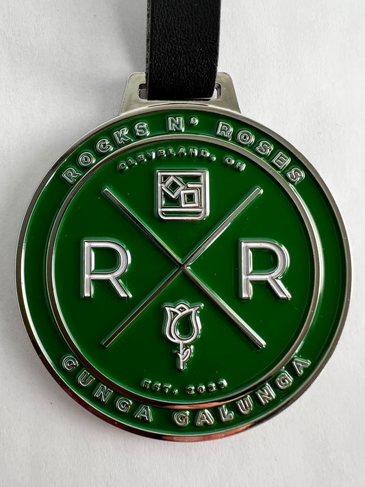 close up of the Rocks N' Roses Gunga Galunga Metal Die Stamped Golf Bag Tag in green and white.