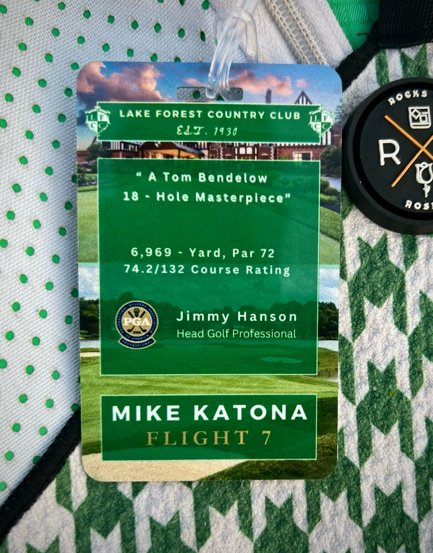 Image an aluminum member guest golf bag tag that lists club stats, the head golf pro, member guest participant name and flight.