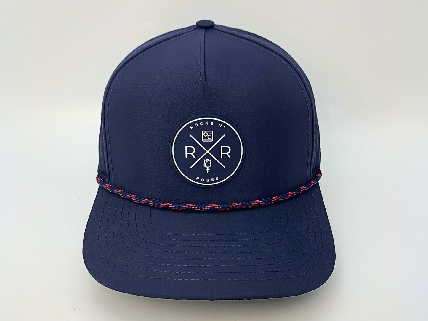 Rocks N' Roses Polyester Navy Blue Golf Hat featuring a navy blue and white rubber logo and navy blue and red decorative rope.