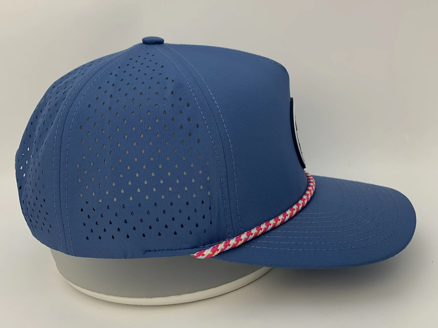Rocks N' Roses Polyester Steel Blue Golf Hat showing laser perforated panels that deliver maximum breathability and red, white, and blue decorative rope.