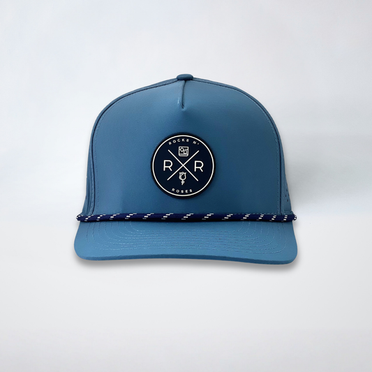 Rocks N' Roses Polyester Blue Steel Golf Hat featuring a navy blue and white rubber logo as well as a navy blue and white decorative rope.