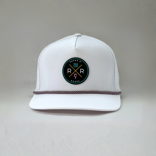 White golf hat made of performance polyester that is water resistant featuring a teal, pink, gold and black rubber logo and pink and black accent rope.