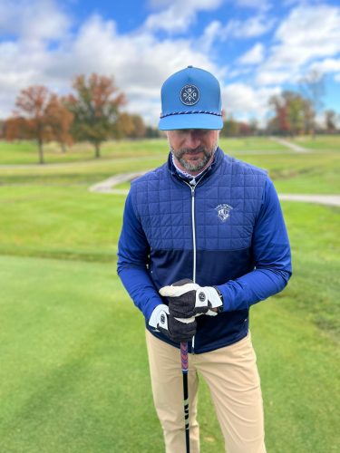 Man wearing the Rocks N' Roses Blue Steel Golf Hat. Performance Golf Hat featuring a blue and white rope, 3D rubber logo, and adjustable snapback.
