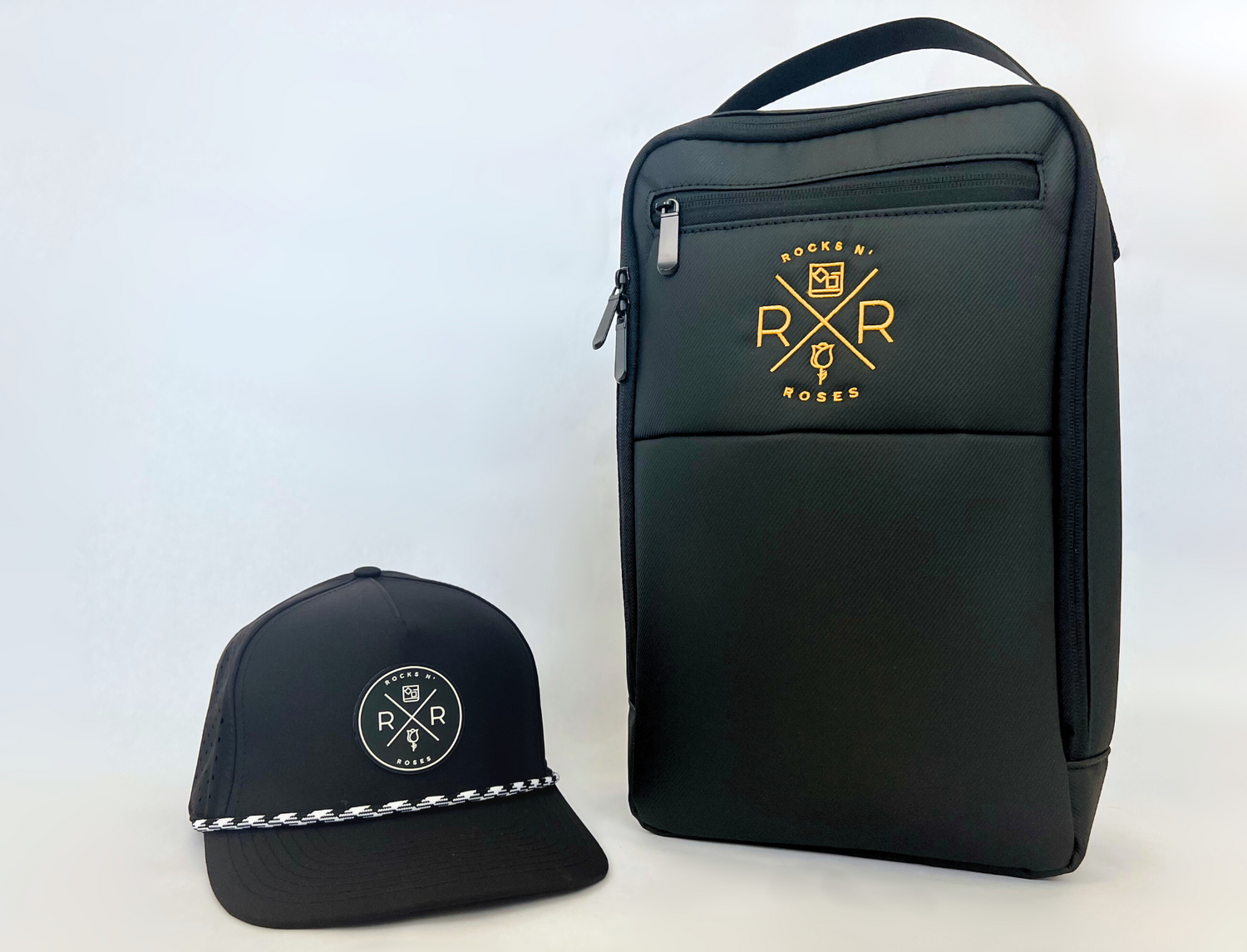 Image of the Rocks N' Roses Golf Hat and Shoe Bag Bundled featuring a black golf shoe bag and black golf hat.