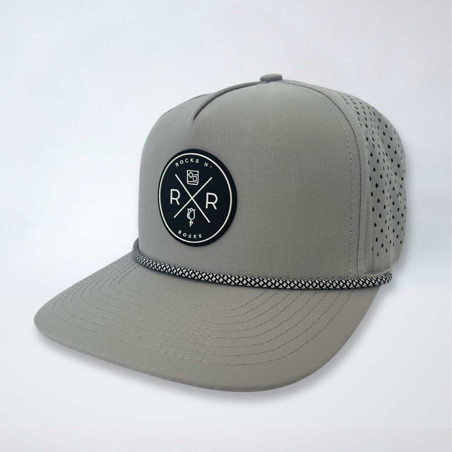 image of a gray snapback golf hat performance hat laser-perforated back for breathability and 3D rubber molded logo.