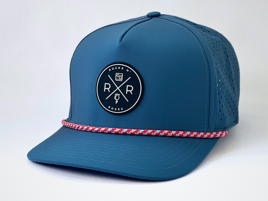 Rocks N' Roses Polyester Steel Blue Golf Hat with Blue and White Rubber logo and red, white, and blue decorative rope.