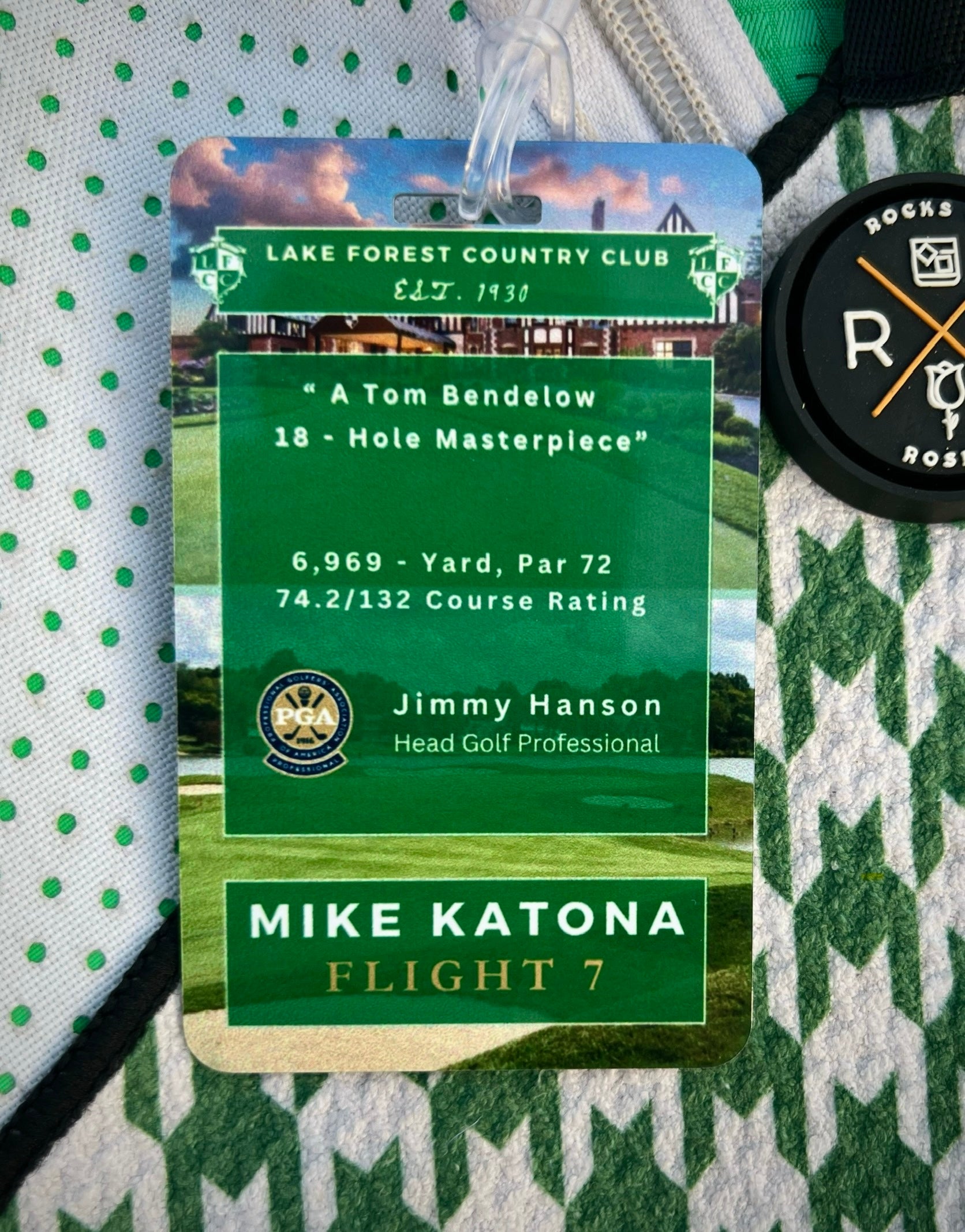 Image an aluminum member guest golf bag tag that lists club stats, the head golf pro, member guest participant name and flight.