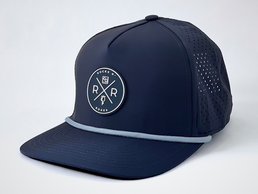 Rocks N' Roses Polyester Navy Blue Golf Hat with Blue and White Rubber logo and light blue decorative rope. 