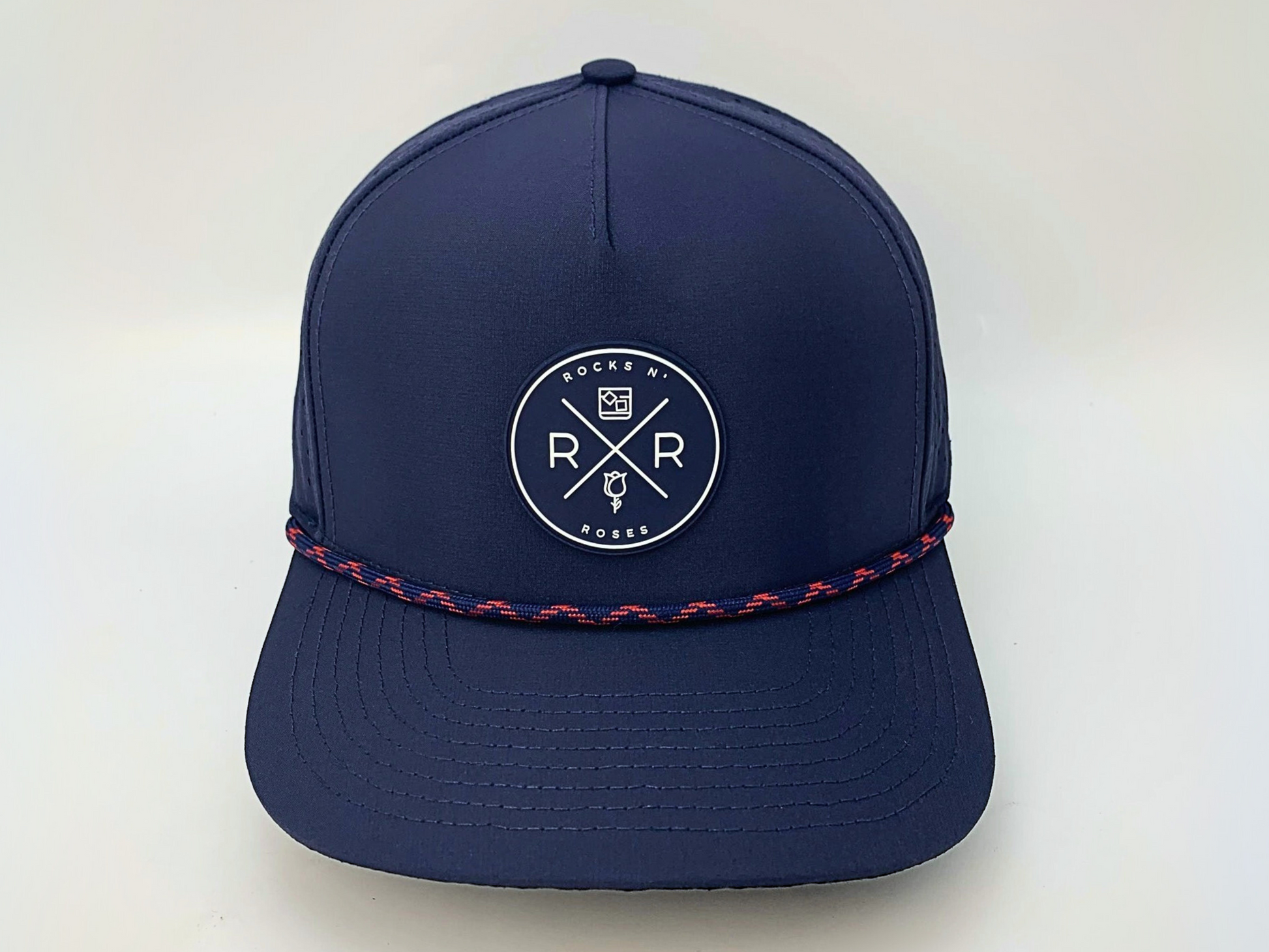 Rocks N' Roses Polyester Navy Blue Golf Hat featuring a navy blue and white rubber logo and navy blue and red decorative rope.