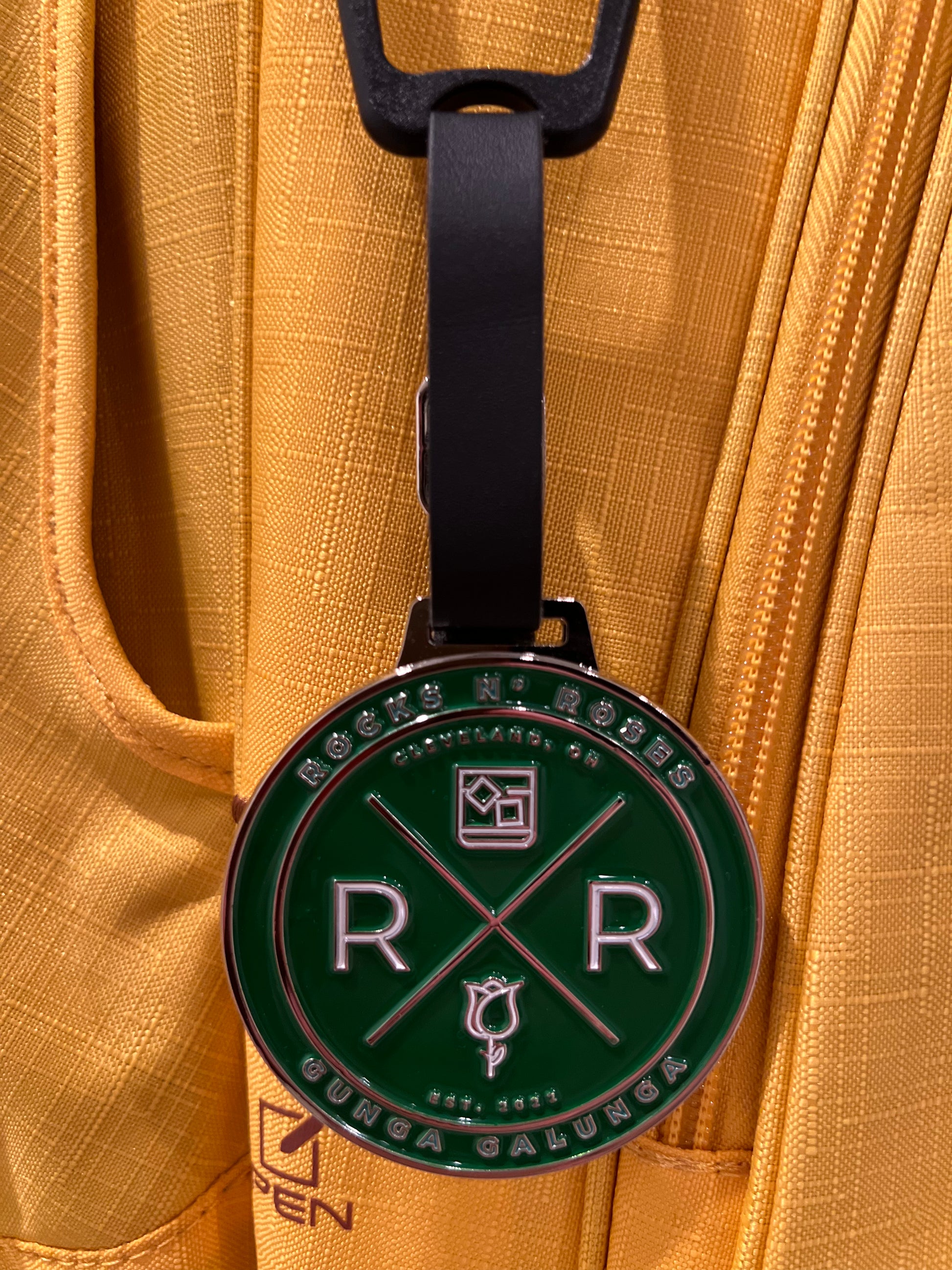 Rocks N' Roses Gunga Galunga Metal Die Stamped Bag Tag in green and white with a leather strap.
