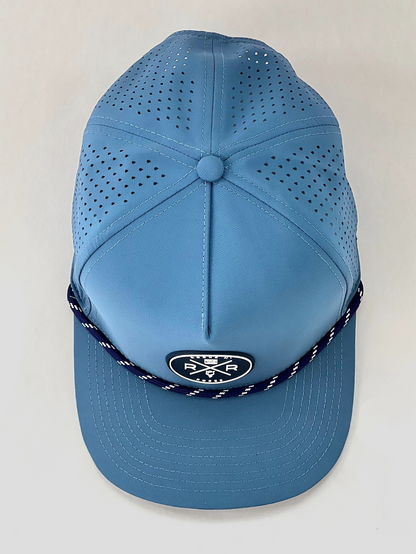 Rocks N' Roses Polyester Blue Steel Golf Hat overhead photograph showing laser perforated back panels navy blue and white rubber logo and navy blue and white decorative rope.