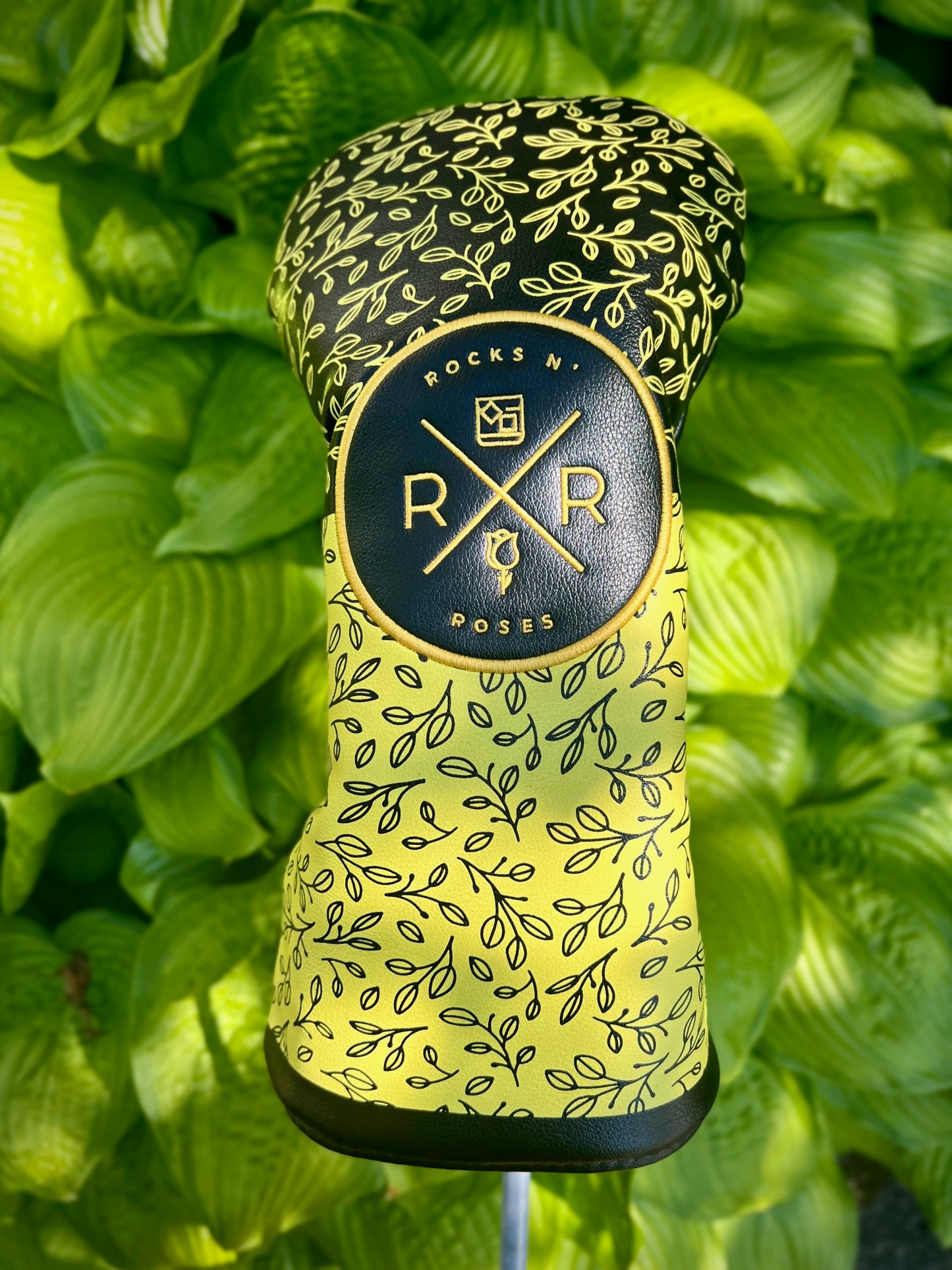Image of the Rocks N' Roses PU Leather driver headcover. This driver headcover features a gold and black floral pattern and embroidered Rocks N' Roses logo.