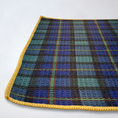 Close up of Rocks N' Roses waffle weave magnetic golf towel with tartan pattern.