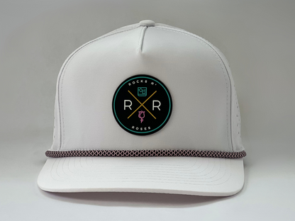 White golf hat made of performance polyester that is water resistant featuring a teal, pink, gold and black rubber logo and pink and black accent rope.