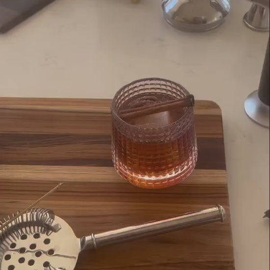 How to video showing how to make a Pecan Infused Old Fashioned cocktail using Nat's Nuts Cinnamon Whiskey Pecans, the, Rocks N' Roses Spinning Whiskey Bourbon Glass and Yes Cocktail Company's Old Fashioned infused sugar cubes.