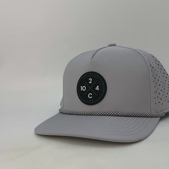 Video of the Rocks N' Roses Performance Golf Hat showing up close detail of the material, rope, 3D Logo, laser perforation and inside of hat.