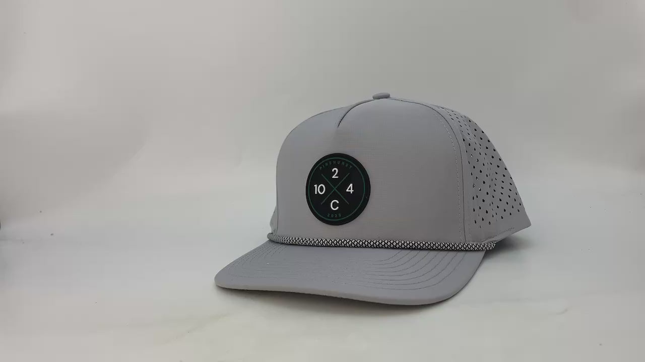 Video of the Rocks N' Roses Performance Golf Hat showing up close detail of the material, rope, 3D Logo, laser perforation and inside of hat.